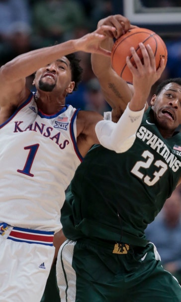 No. 1 Kansas holds off No. 10 Michigan State 92-87 in opener
